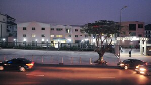 A hotel with a modern facade, multiple windows, and a sign reading "TOMREIK HOTEL". - Tomreik Hotel (Accra)