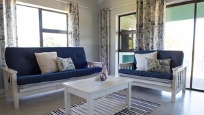 Self-catering Unit B  | Living area | 32-inch flat-screen TV with satellite channels, TV - Osler Place Stilbaai (Still Bay)