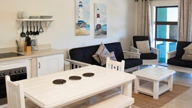 Self-catering Unit A | Living area | 32-inch flat-screen TV with satellite channels, TV - Osler Place Stilbaai (Still Bay)