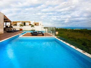 Outdoor pool, open 8:00 AM to 9:00 PM, pool umbrellas, pool loungers