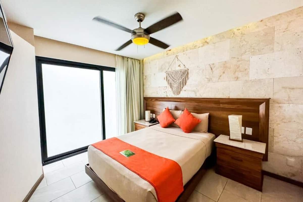 Hypo-allergenic bedding, down duvets, desk, laptop workspace