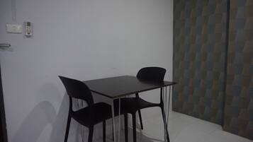 Standard Room | Living area | 32-inch LCD TV with cable channels, TV