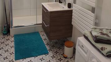 Bathtub, hair dryer, towels, soap