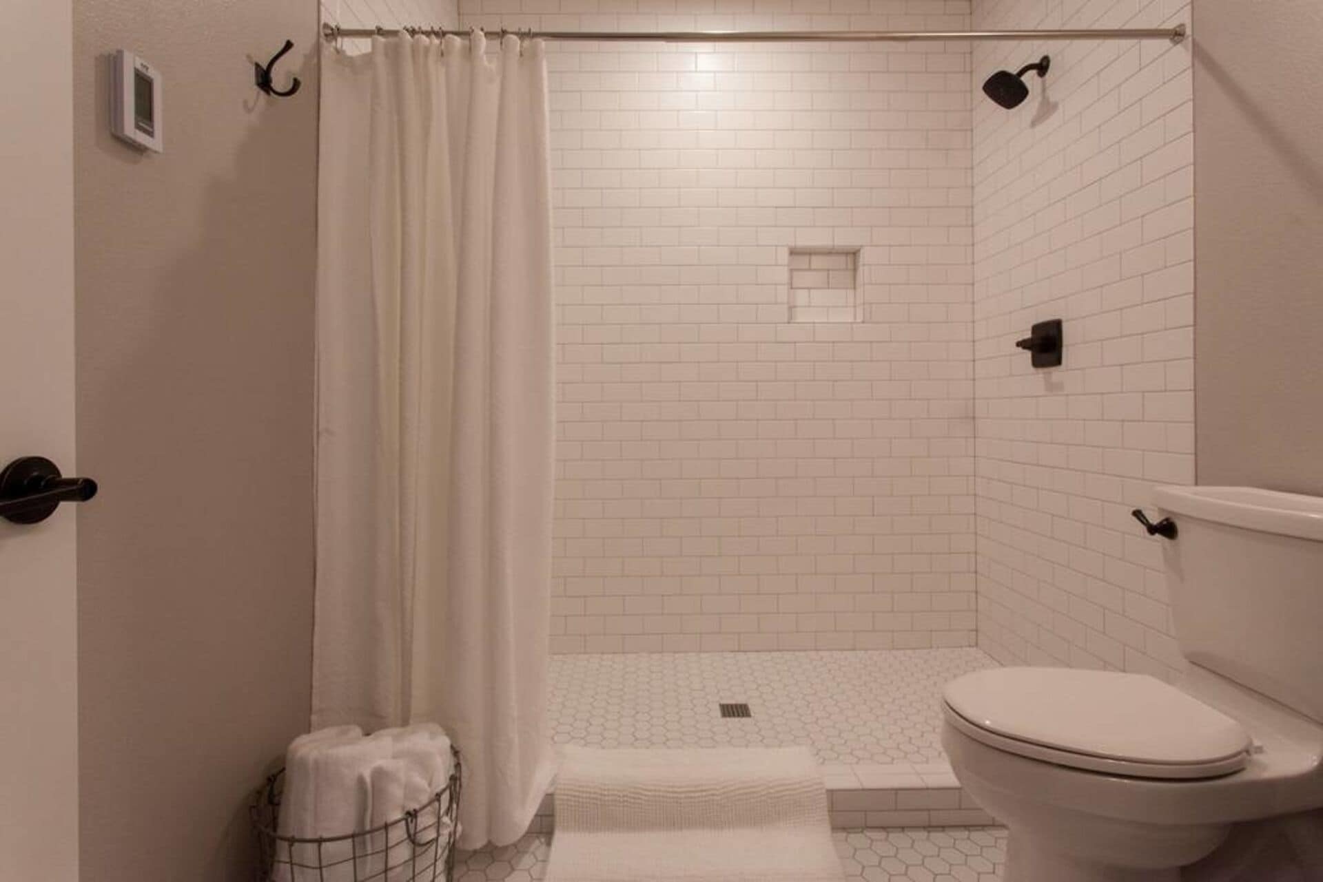 Shower, hair dryer, heated floors, towels