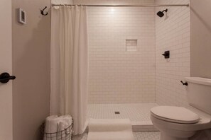 Shower, hair dryer, heated floors, towels