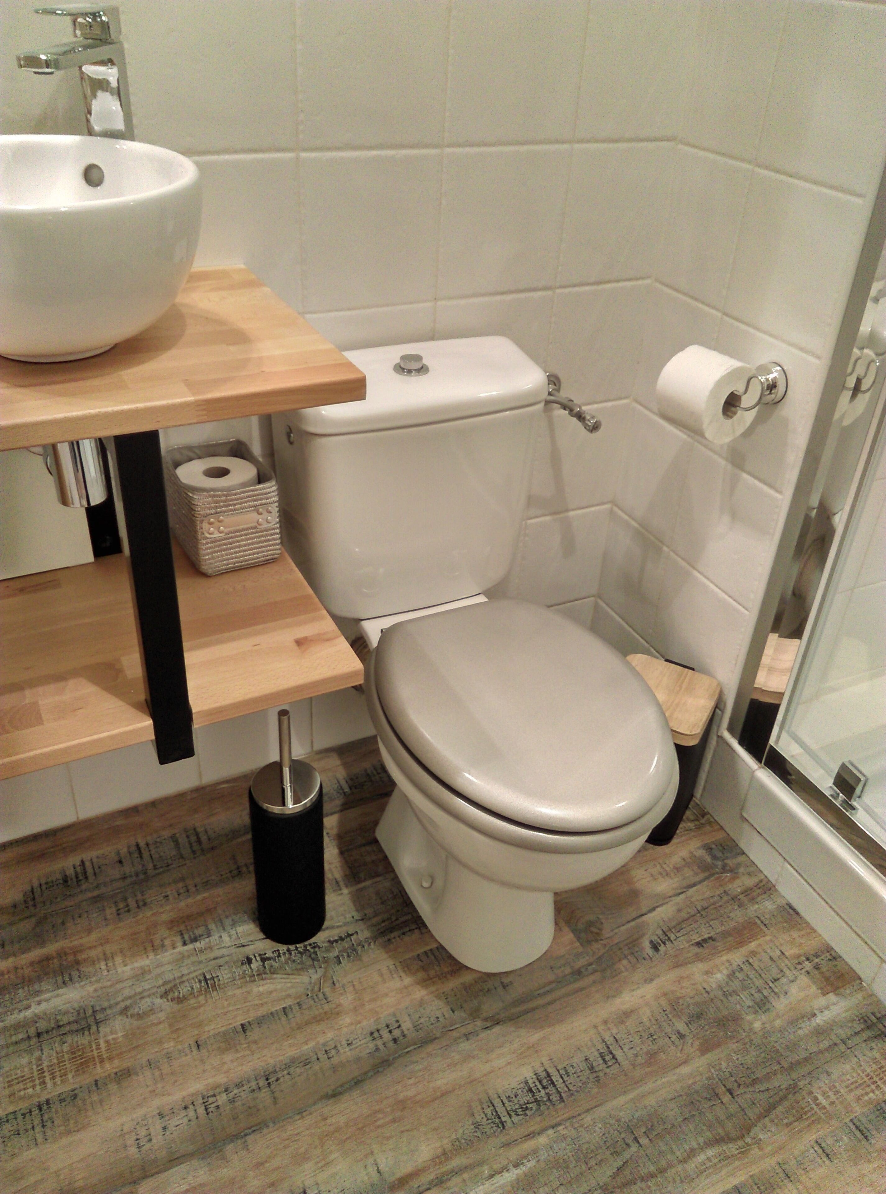 A bathroom with a toilet, sink, and shower.