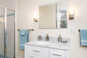 Combined shower/tub, hair dryer, towels, soap