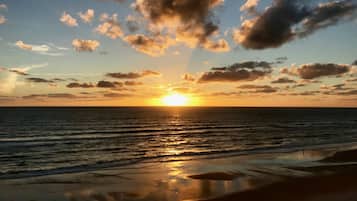 On the beach, sun-loungers, beach towels