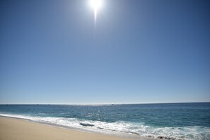 On the beach, sun loungers, beach towels