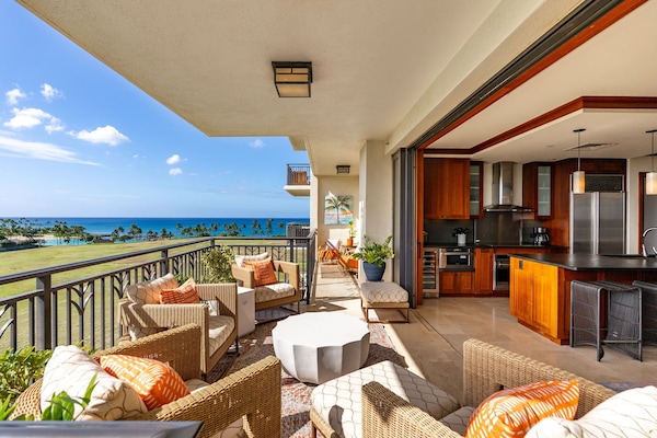 The floor to ceiling sliding glass doors retract all the way into the walls