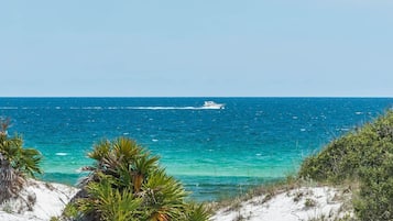 On the beach, sun loungers, beach towels