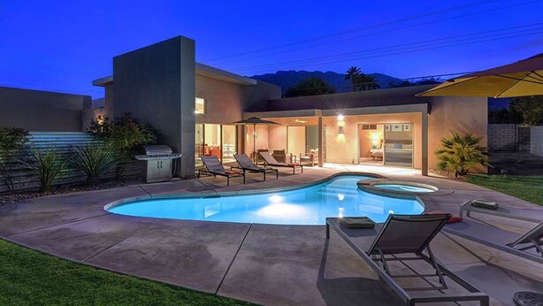 A modern house with a swimming pool, outdoor seating, and a barbecue area. - Cool Modern Pool & Spa, 2 Bedroom + Private Den House. (Palm Springs)