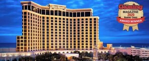 A large, multi-story hotel with a classic architectural design, featuring a prominent marquee at the top.