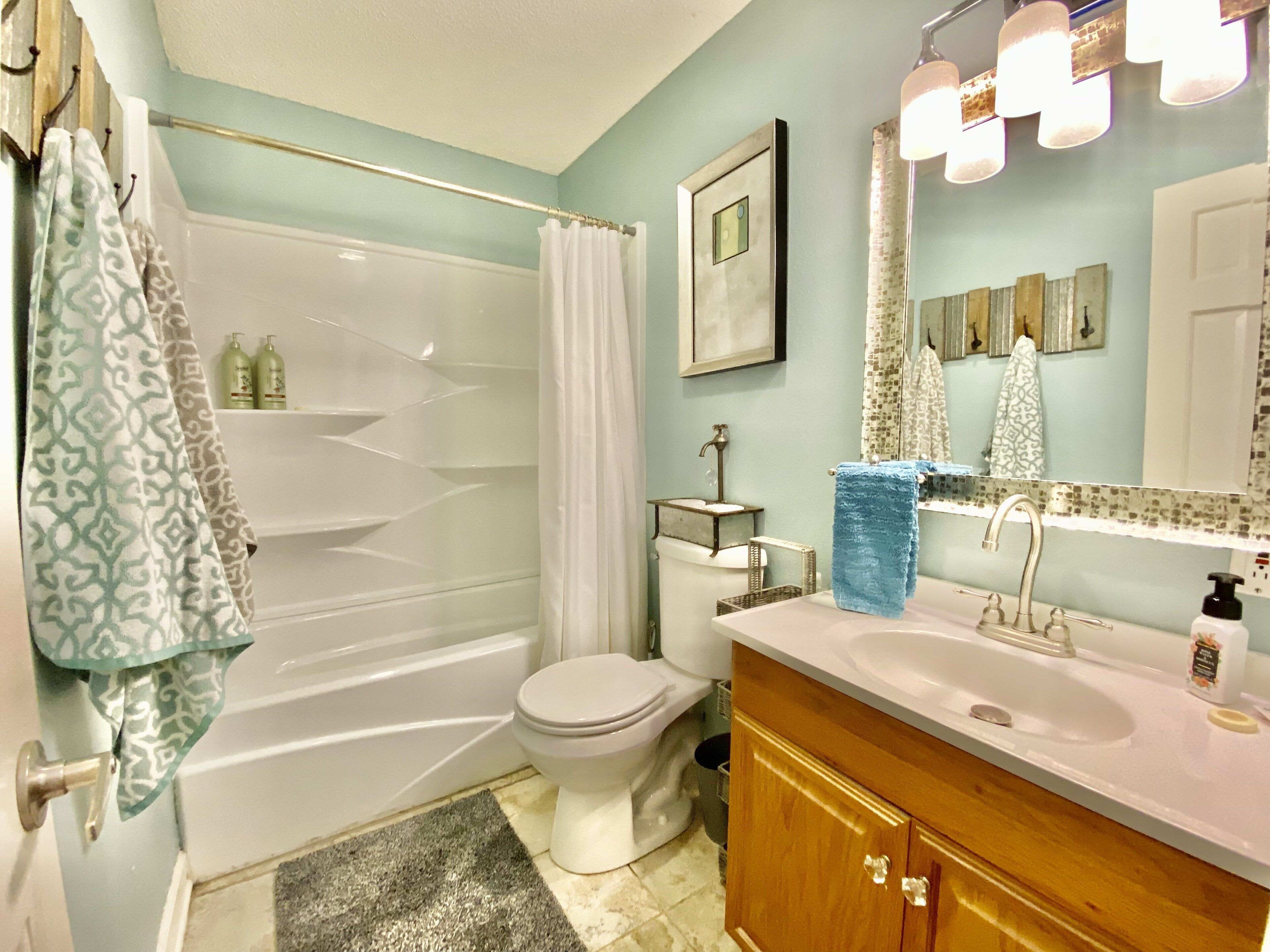 Combined shower/tub, hair dryer, towels, soap