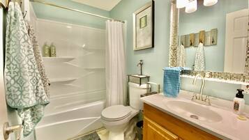 Combined shower/tub, hair dryer, towels, soap