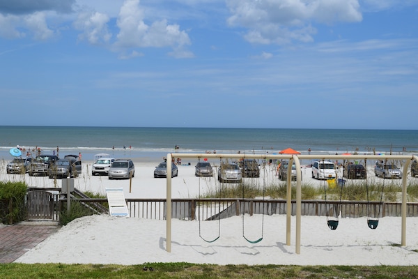 On the beach, sun-loungers, beach towels