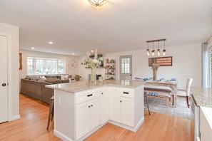 Enjoy meals in the kitchen with a dining area and seating space.