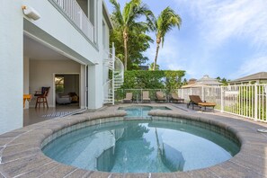 Outdoor pool, a heated pool - Beautiful Gated Waterfront Home 5 Minutes From Barefoot Beach (Bonita Springs)