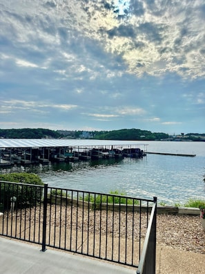 Enjoy serene lakeside views and easy access to the water with a dock and boats at your fingertips.