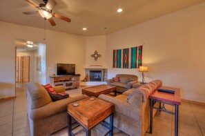 Smart TV, fireplace, books, stereo