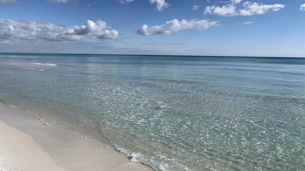A beach with clear turquoise water and a sandy shore. - Emerald Isle 107-On the Beach-Ground Floor (Fort Walton Beach)