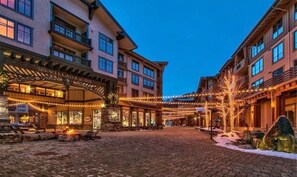 Stroll through the charming hotel courtyard, surrounded by historic buildings with balconies.