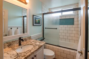 Bathtub, hair dryer, towels, soap