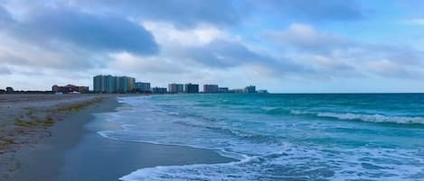 On the beach, sun-loungers