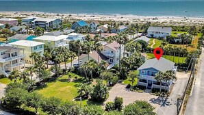 A coastal residential area with houses, a beach, and a clear sky. - Ocean Song – Large 2 Bedroom with Private Ocean View Balcony & Sea Breezes & Pool Access (St. Augustine)