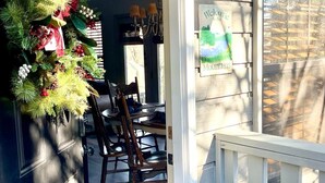 A dining area with a Christmas tree, a chandelier, and a welcome sign. - 3 BR/3BATH Retreat 1.5 miles from Attraction/Resort Pool/Pool Table/Arcade (Pigeon Forge)