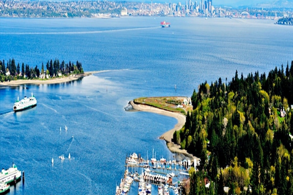 View of Bainbridge's Eagle Harbor and downtown Seattle across Puget Sound.