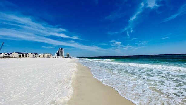 A beach with a clear sky and waves. - August Dates Still Available This Summer - Enjoy this Comfy 3 Bedroom Unit! (Orange Beach)