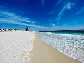 A beach with a clear sky and waves. - August Dates Still Available This Summer - Enjoy this Comfy 3 Bedroom Unit! (Orange Beach)