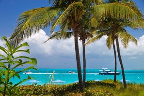 On the beach, sun loungers, beach towels - VILLA RENAISSANCE 603, 1BR in Grace Bay. Steps to the sand. WOW (Grace Bay)