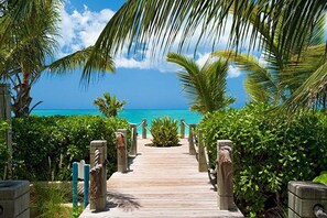On the beach, sun loungers, beach towels - VILLA RENAISSANCE 603, 1BR in Grace Bay. Steps to the sand. WOW (Grace Bay)