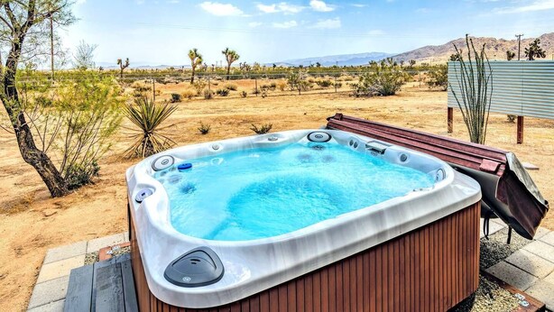 A hot tub in a desert setting with a clear view of the surrounding landscape. - Joshua Tree Getaway Private Desert Views (Yucca Valley)