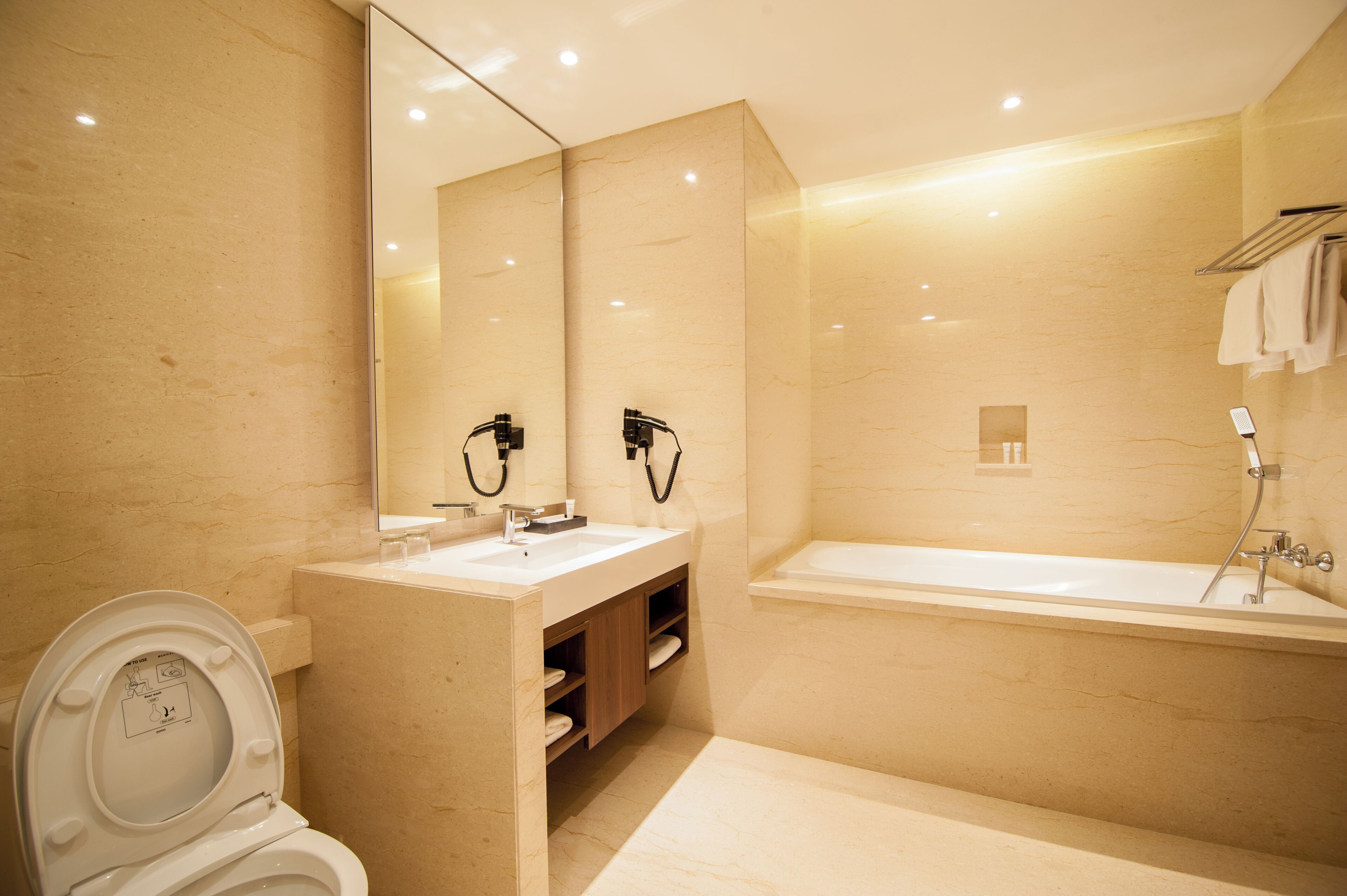 junior suite | bathroom | shower, free toiletries, hair dryer, slippers