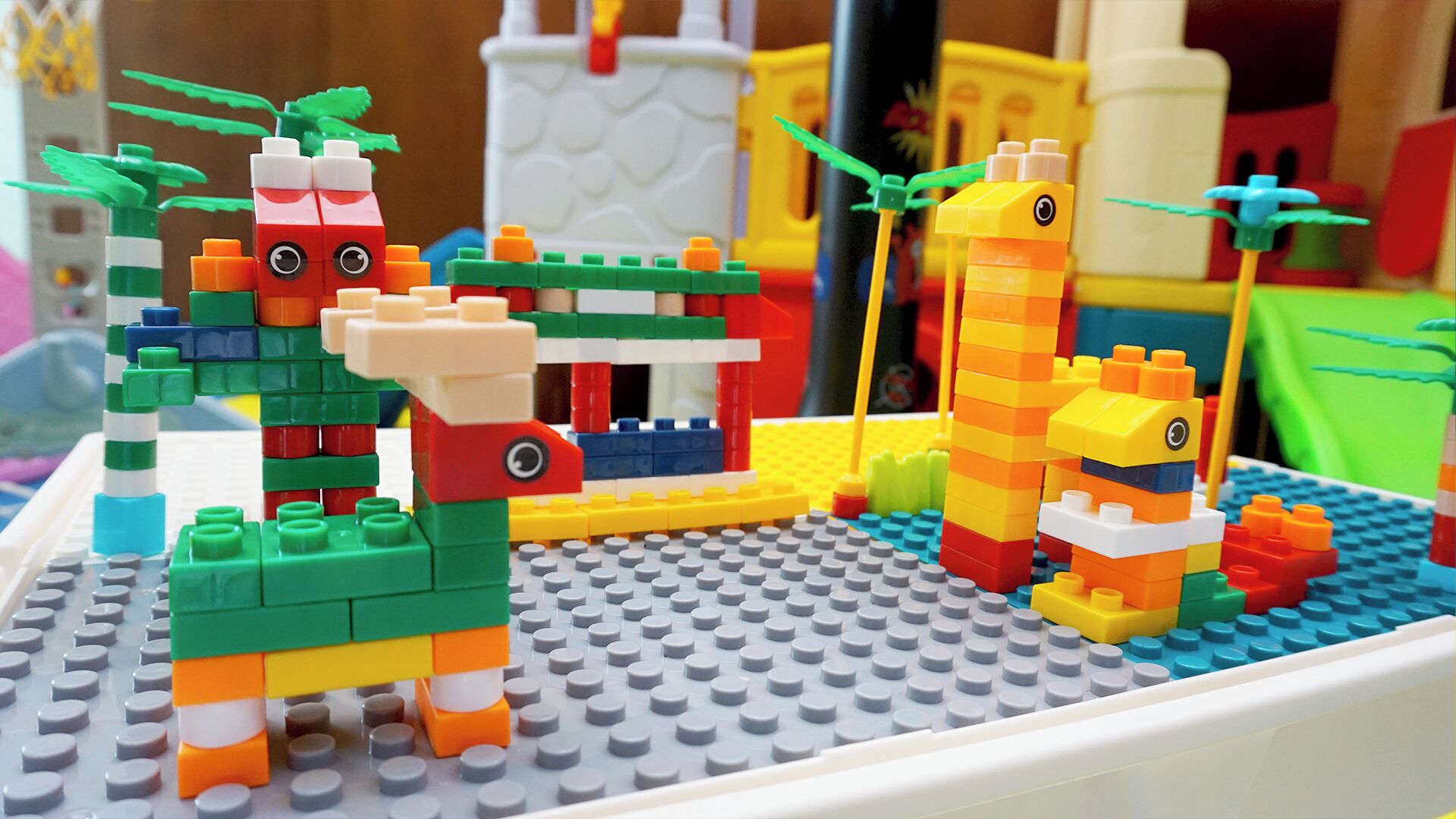 A LEGO playset with various colorful figures and structures.