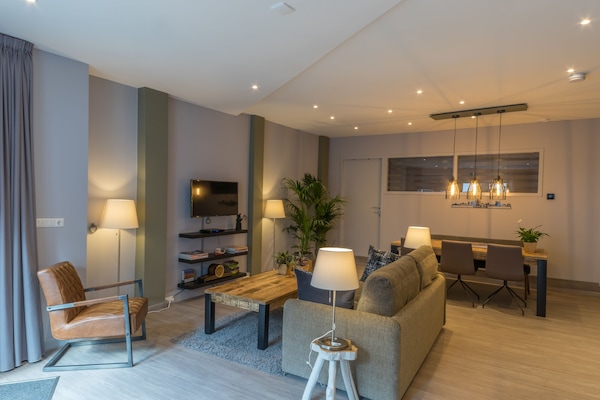 Deluxe Apartment, 1 Bedroom, Kitchen, Ground Floor (Tulp) | Living area | Flat-screen TV