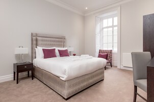 Desk, iron/ironing board, travel cot, rollaway beds