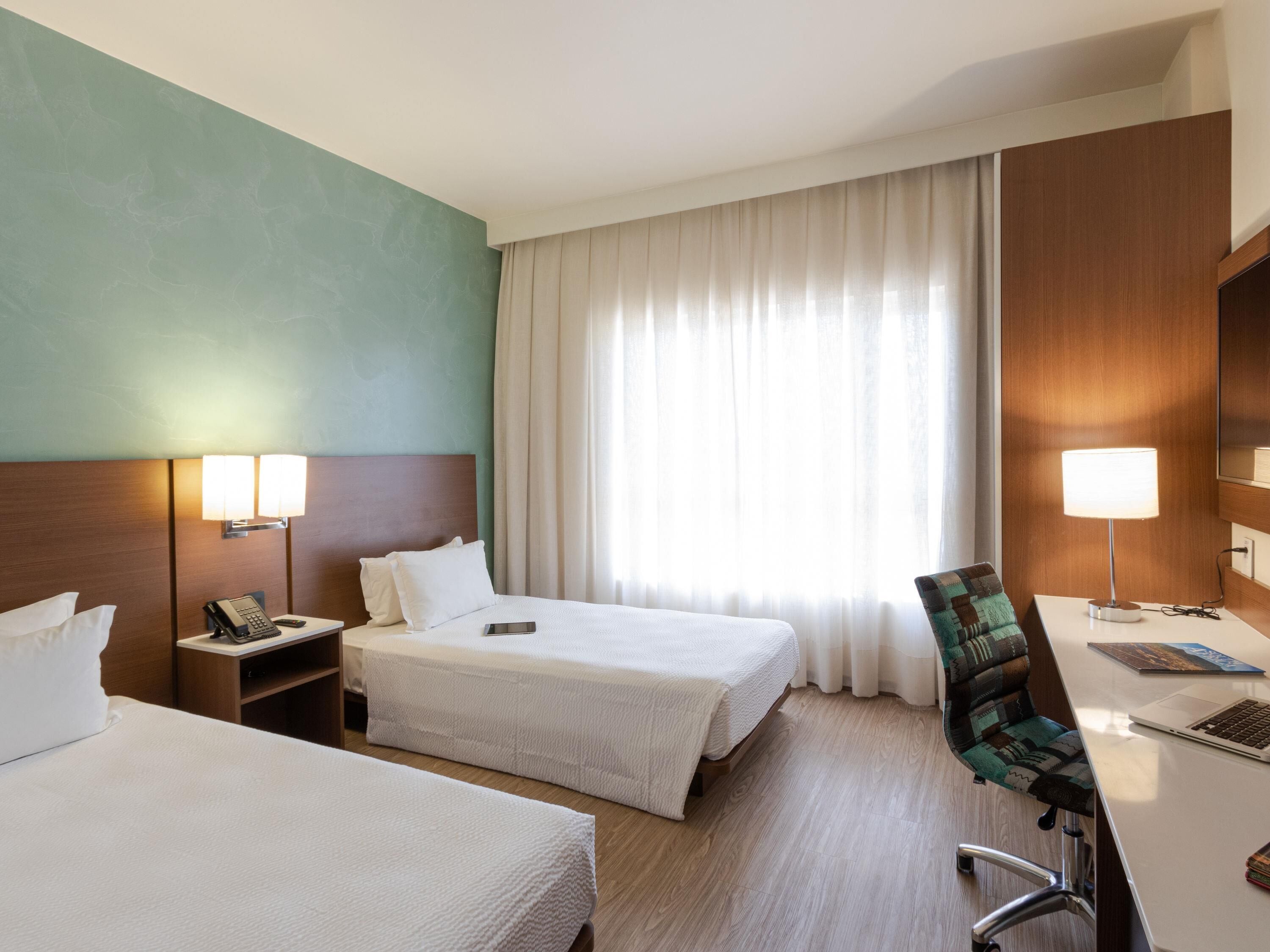 Leilighet – standard, 2 enkeltsenger | Sengetøy av topp kvalitet, senger med overmadrass og safe på rommet