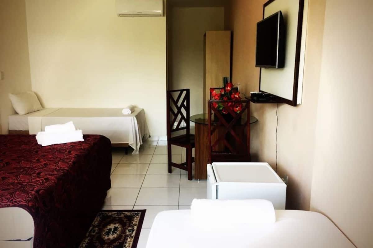Family Room | Premium bedding, desk, blackout drapes, iron/ironing board