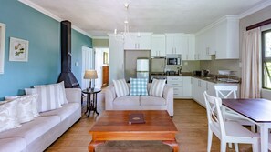 Kruger Cottage | Living area | 32-inch TV with satellite channels - Kangelani Lodge (Assagay)