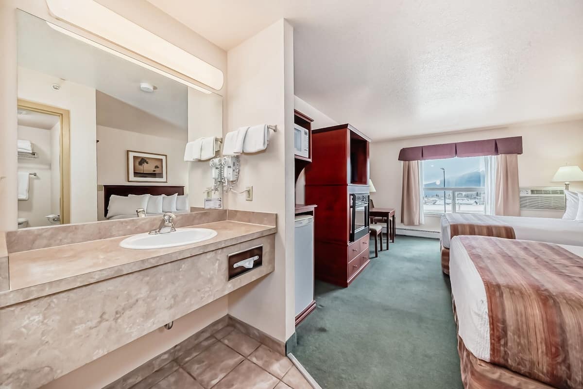 double room, 2 queen beds | bathroom | free toiletries, hair dryer, towels