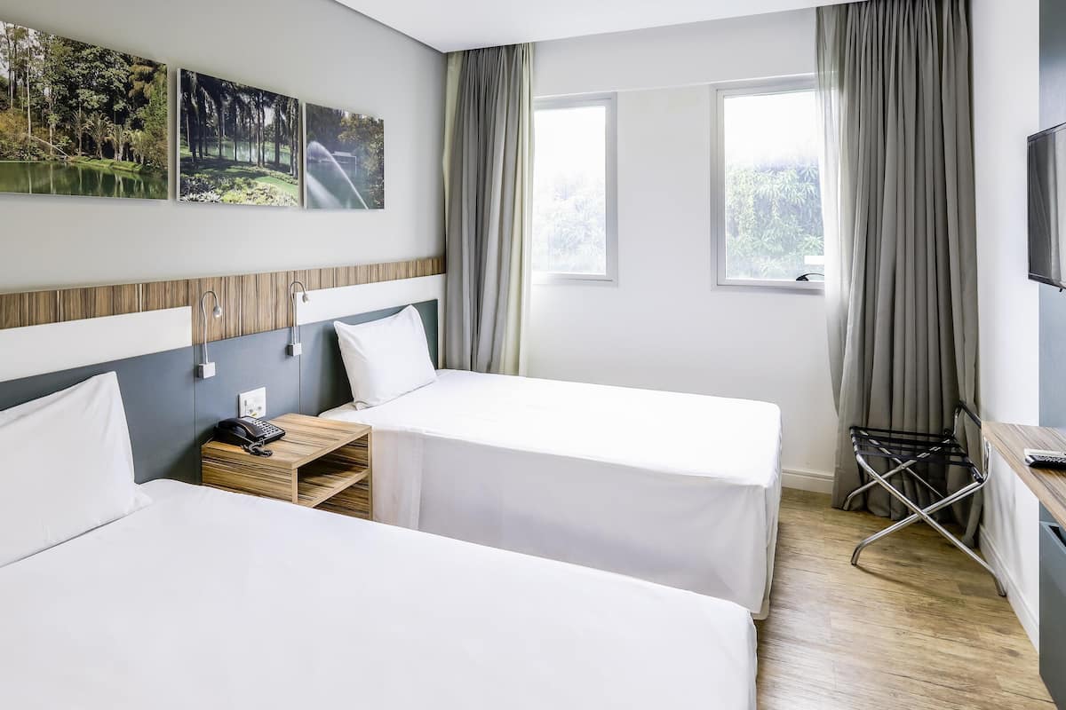 Standard Apartment, 2 Twin Beds | Minibar, in-room safe, desk, laptop workspace