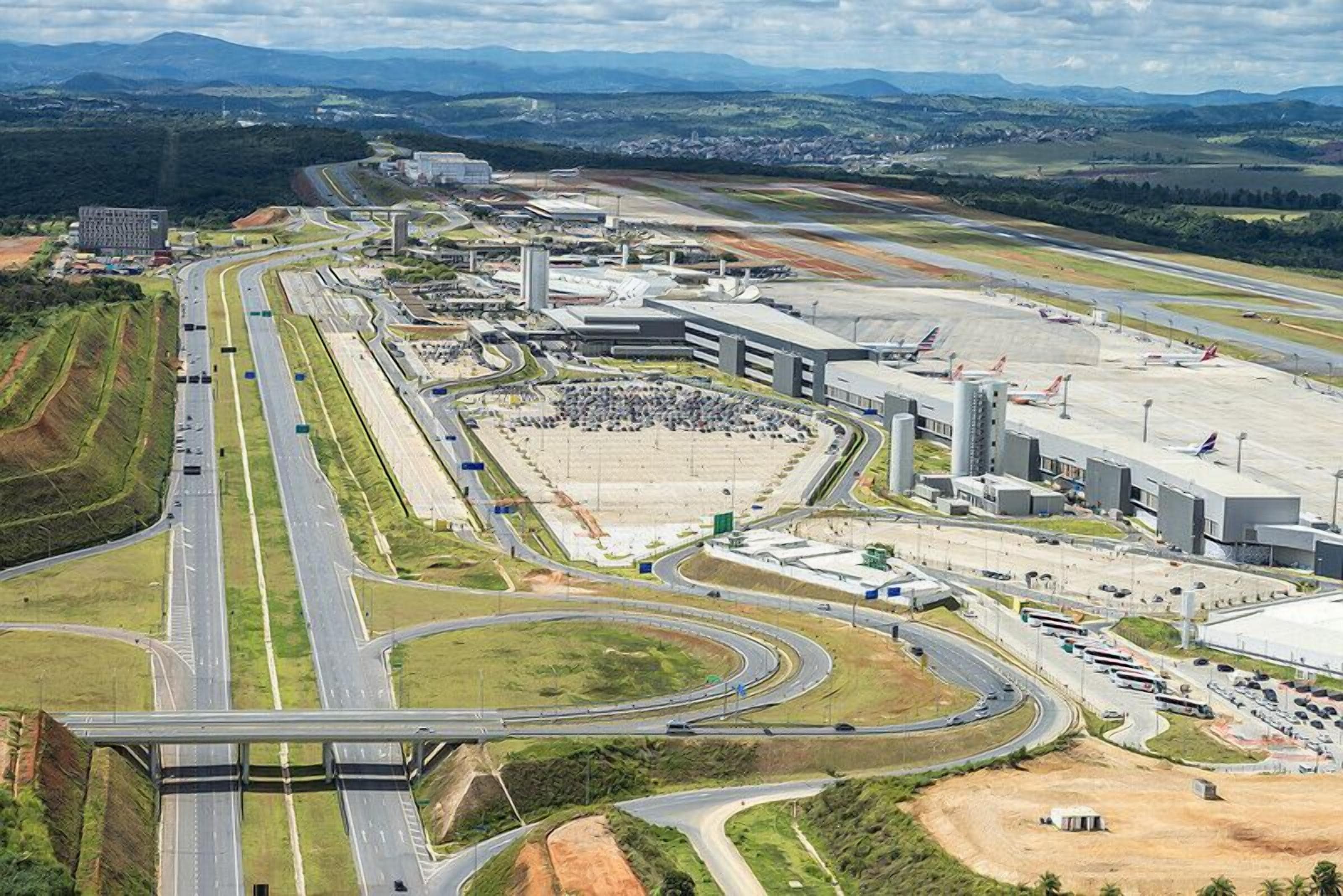An airport with multiple runways, terminals, and a large parking area.
