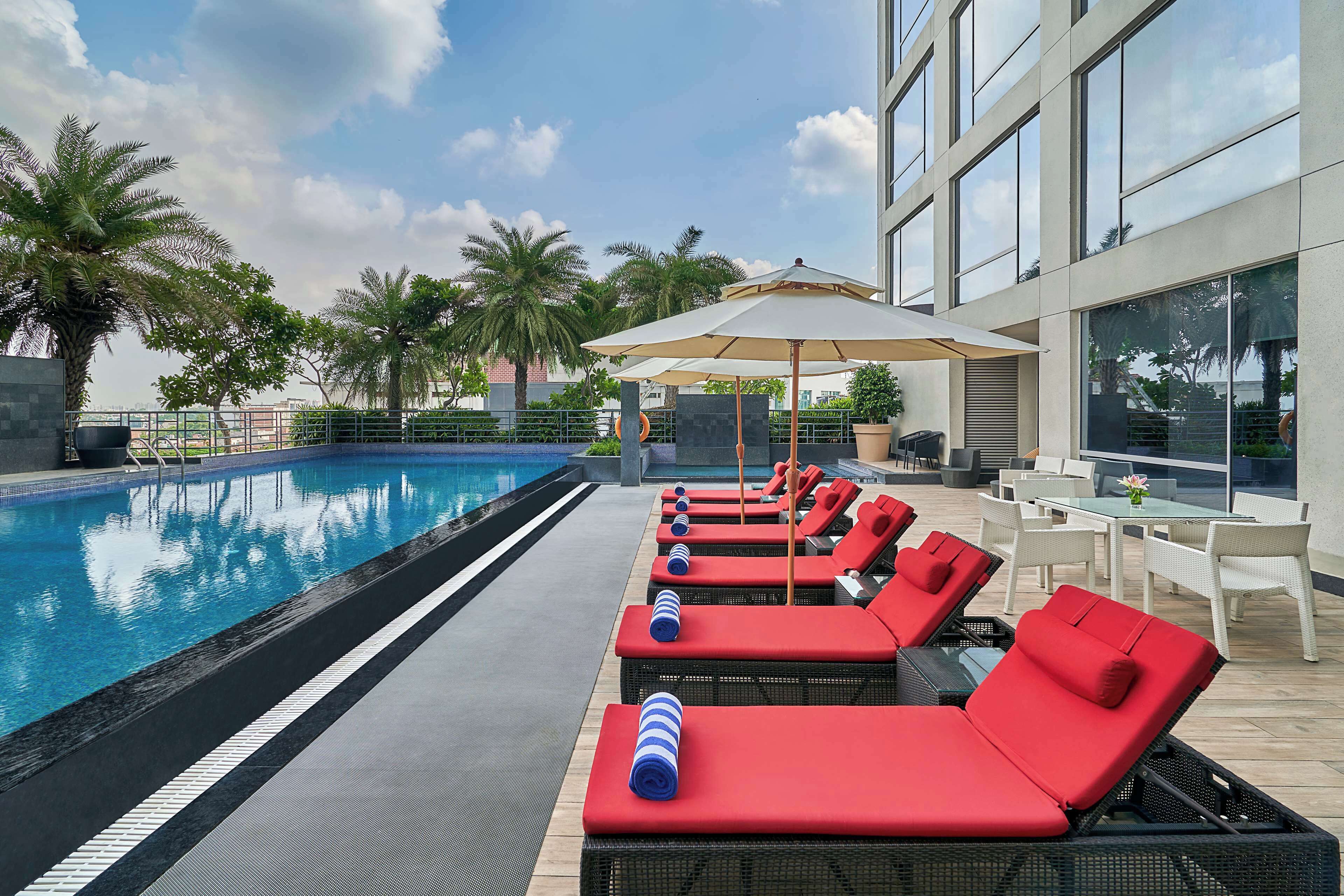 Outdoor pool, free pool cabanas, pool umbrellas