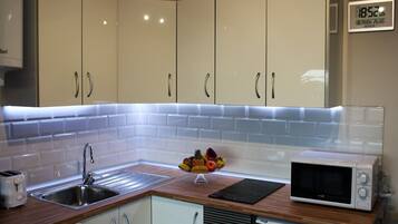 Fridge, microwave, stovetop, coffee/tea maker