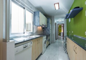 Dishwasher, coffee/tea maker, cookware/dishes/utensils