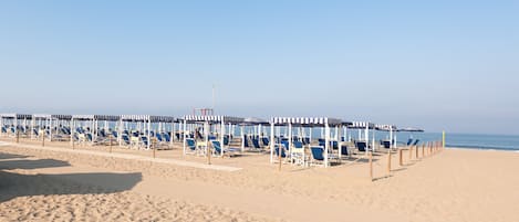 On the beach, sun loungers